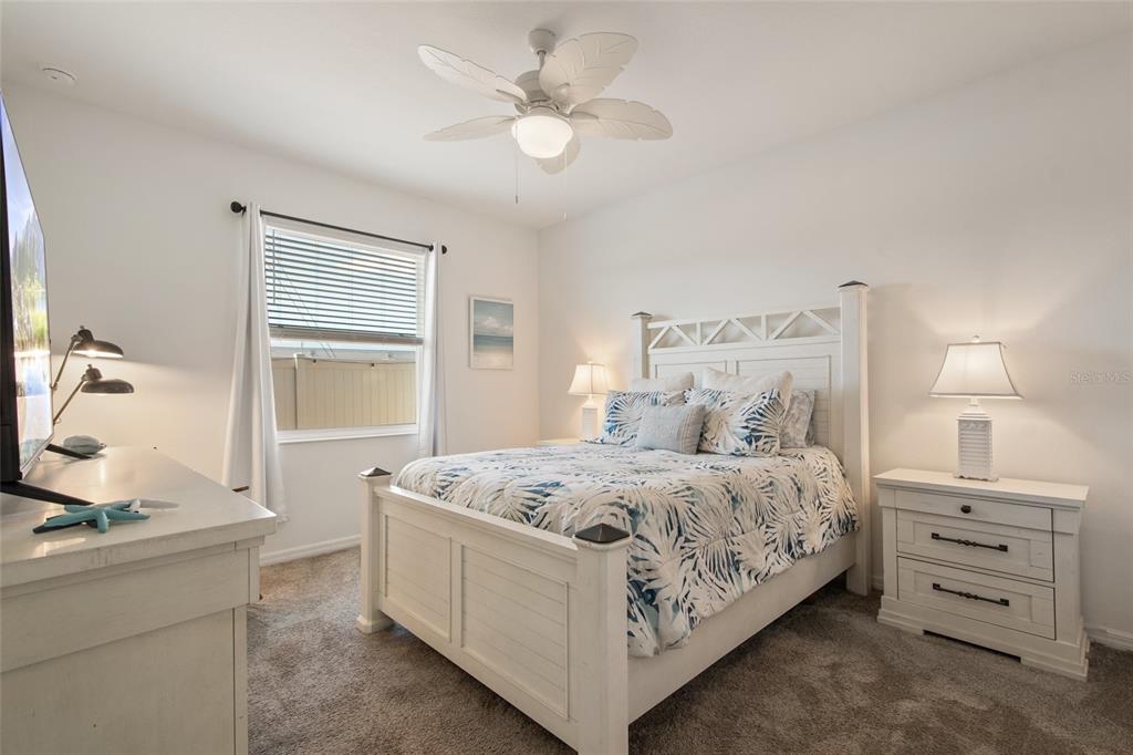 1172 Tyler Loop Lake Wales, FL 33859 - Photo 24 of 56 a bedroom with a bed and a chandelier