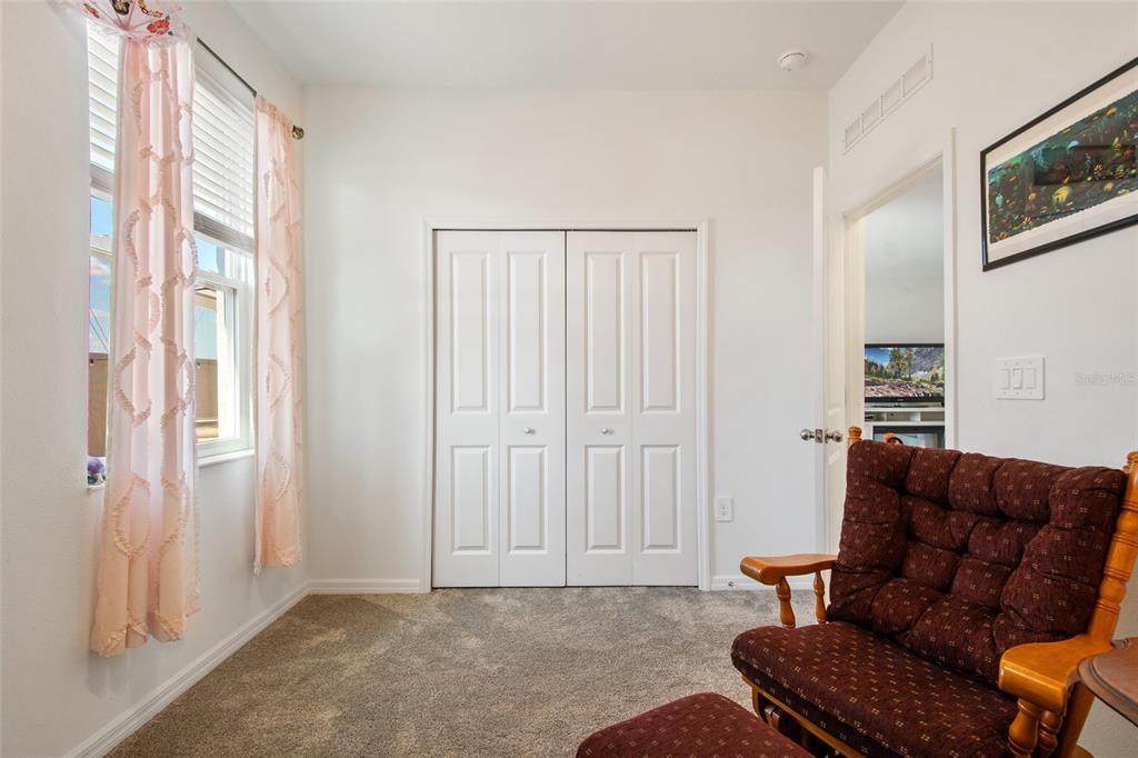 1172 Tyler Loop Lake Wales, FL 33859 - Photo 33 of 56 a living room with furniture and a window