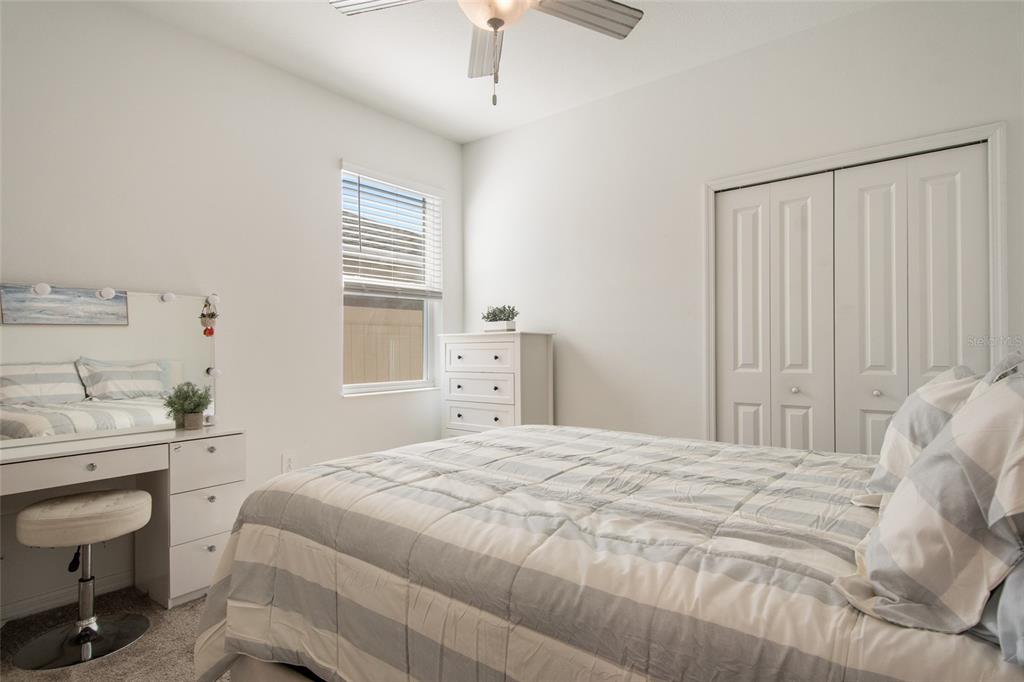 1172 Tyler Loop Lake Wales, FL 33859 - Photo 40 of 56 a bedroom with a bed a desk and chair