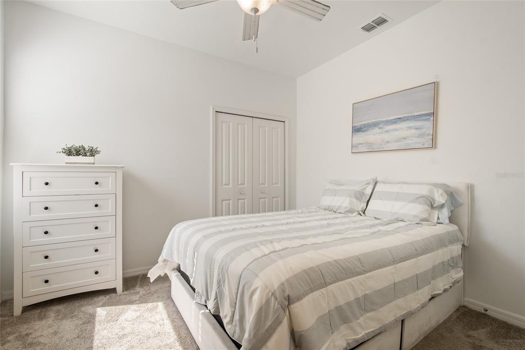 1172 Tyler Loop Lake Wales, FL 33859 - Photo 41 of 56 a bedroom with a bed and a dresser