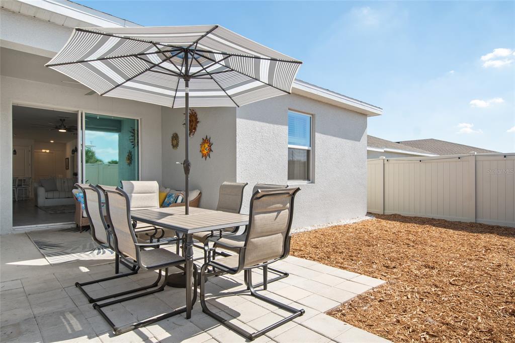 1172 Tyler Loop Lake Wales, FL 33859 - Photo 46 of 56 a view of a patio with a table and chairs