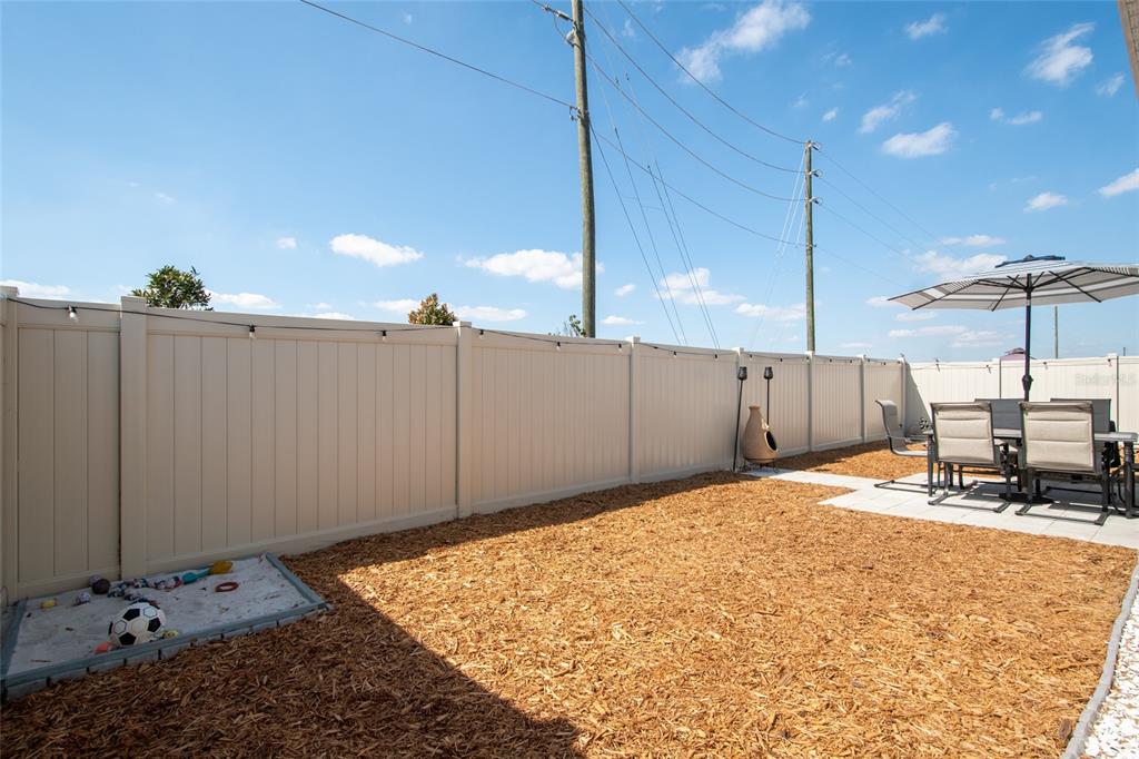 1172 Tyler Loop Lake Wales, FL 33859 - Photo 47 of 56 a bed room with a bed and a night stand