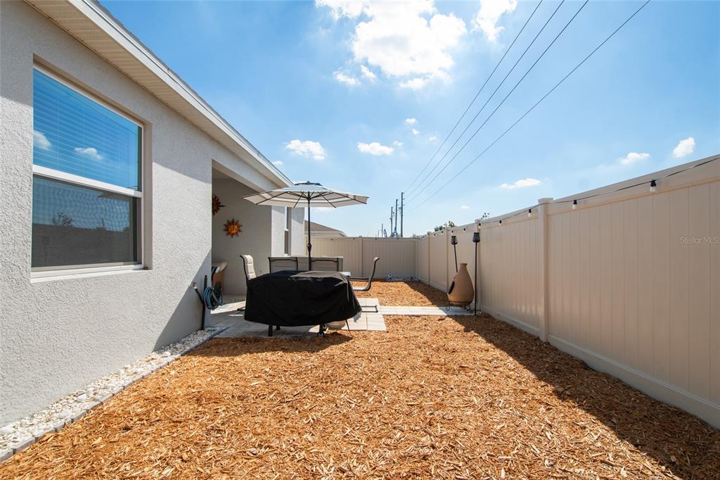 1172 Tyler Loop Lake Wales, FL 33859 - Photo 49 of 56 a living room with furniture and a rug