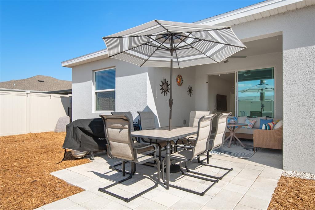 1172 Tyler Loop Lake Wales, FL 33859 - Photo 50 of 56 a view of a dinning table and chairs in the patio