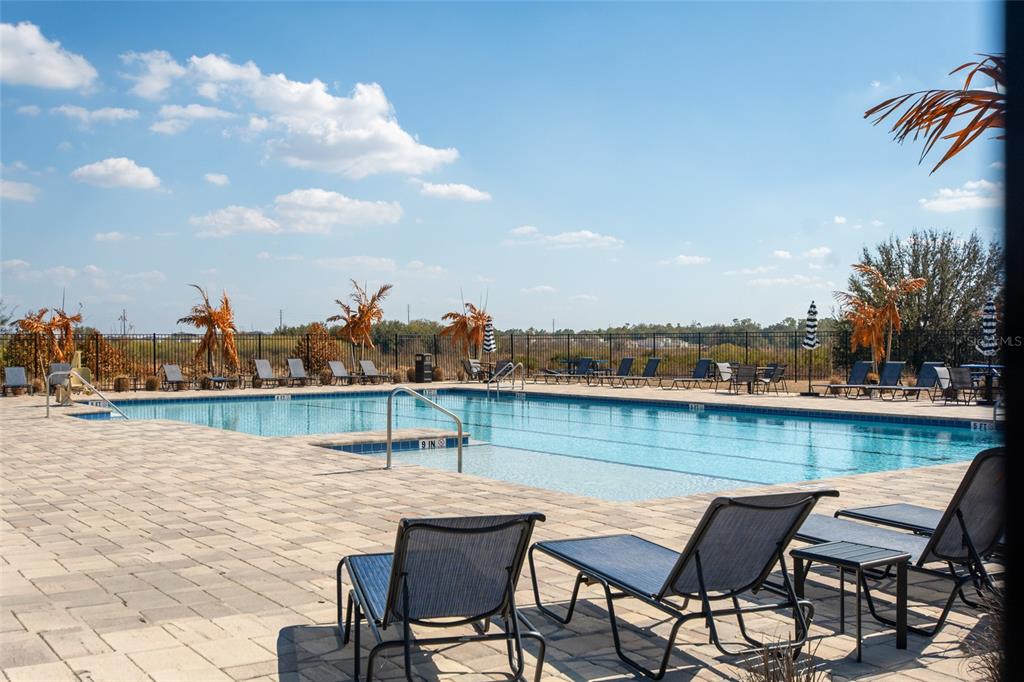 1172 Tyler Loop Lake Wales, FL 33859 - Photo 52 of 56 a view of a lake from a roof deck with chair and table