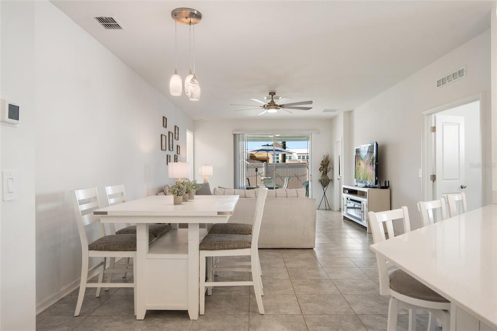 1172 Tyler Loop Lake Wales, FL 33859 - Photo 7 of 56 a view of a dining room with furniture and wooden floor