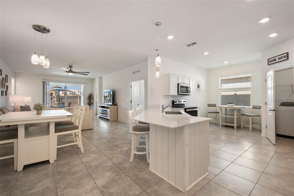 1172 Tyler Loop Lake Wales, FL 33859 - Photo 8 of 56 a large kitchen with a table and chairs in it