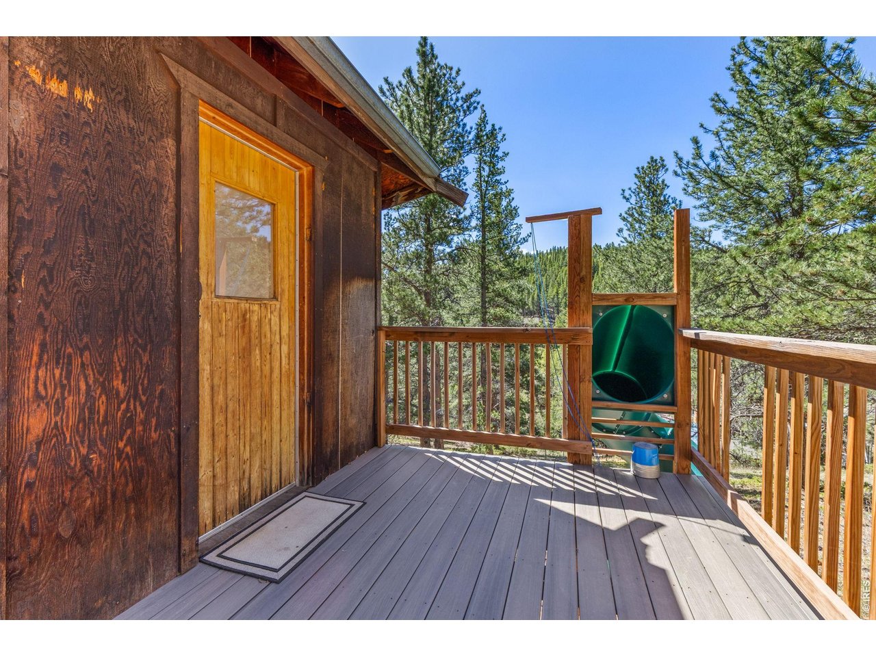414 Upper Travis Gulch Road Black Hawk, CO 80422 - Photo 38 of 50 a view of balcony with wooden floor and outdoor space