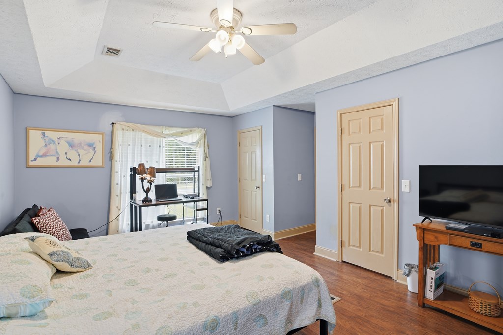 5019 Mccaghren Drive Columbus, GA 31909 - Photo 14 of 22 a bedroom with a bed and a flat screen tv