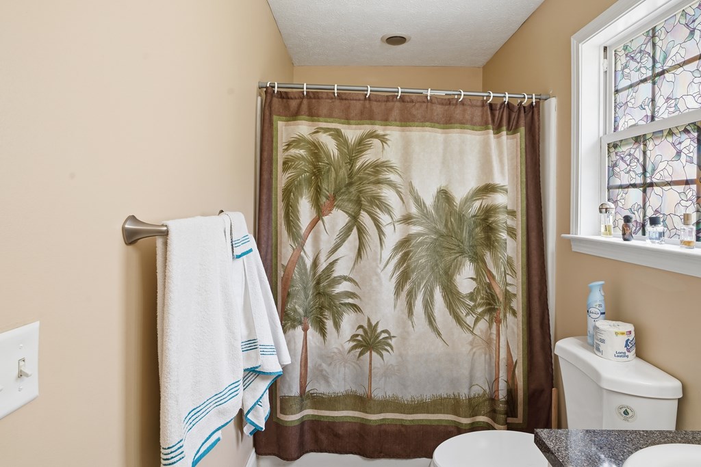 5019 Mccaghren Drive Columbus, GA 31909 - Photo 16 of 22 a bathroom with a bathtub and a shower