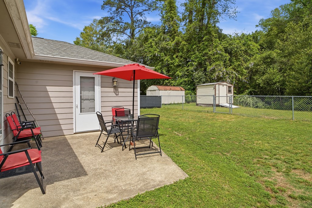 5019 Mccaghren Drive Columbus, GA 31909 - Photo 17 of 22 a patio with glass top table and chairs