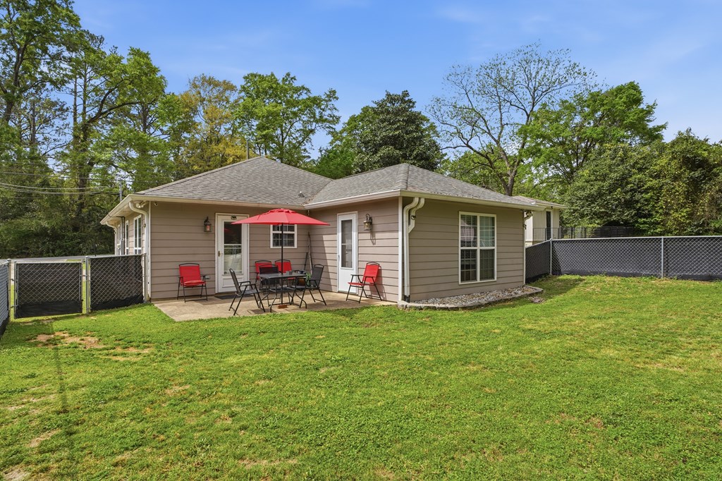 5019 Mccaghren Drive Columbus, GA 31909 - Photo 19 of 22 a view of a house with a backyard and sitting area