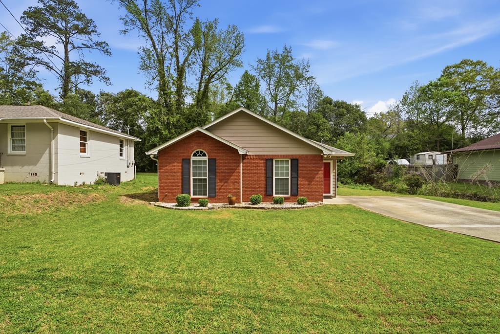 5019 Mccaghren Drive Columbus, GA 31909 - Photo 2 of 22 a front view of house with yard and green space