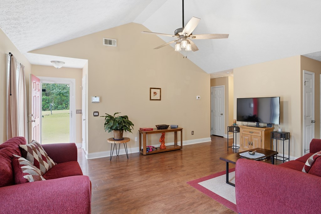 5019 Mccaghren Drive Columbus, GA 31909 - Photo 4 of 22 a living room with furniture and a flat screen tv