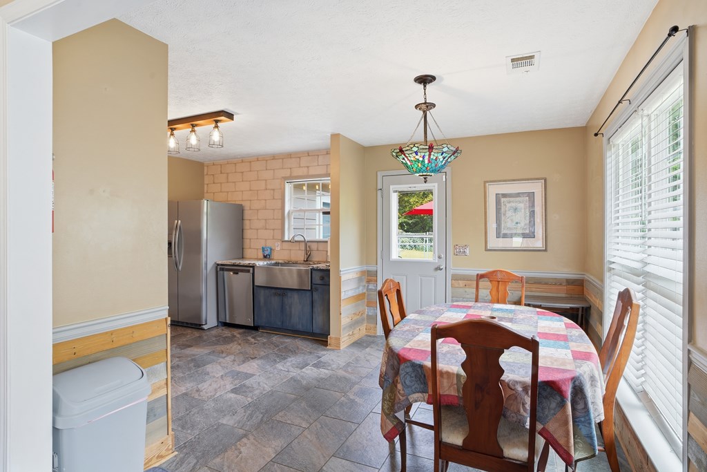 5019 Mccaghren Drive Columbus, GA 31909 - Photo 6 of 22 a view of a dining room with furniture and window