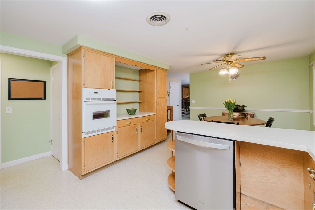 15 Ralsie Road Rehoboth, MA 02769 - Photo 11 of 32 a kitchen with stainless steel appliances a sink and a refrigerator