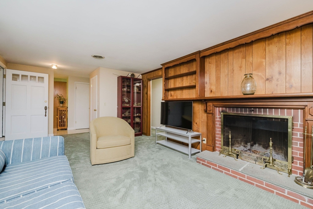15 Ralsie Road Rehoboth, MA 02769 - Photo 16 of 32 a living room with furniture and a fireplace