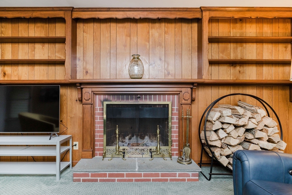 15 Ralsie Road Rehoboth, MA 02769 - Photo 17 of 32 a living room with a fireplace and a flat screen tv