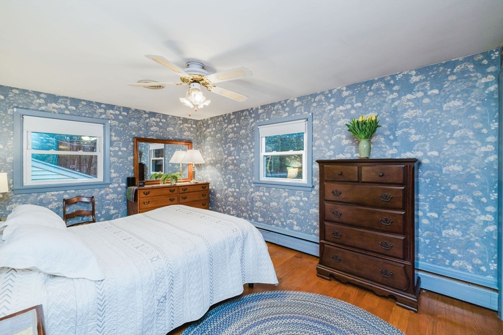 15 Ralsie Road Rehoboth, MA 02769 - Photo 19 of 32 a bedroom with a bed dresser and wooden floor
