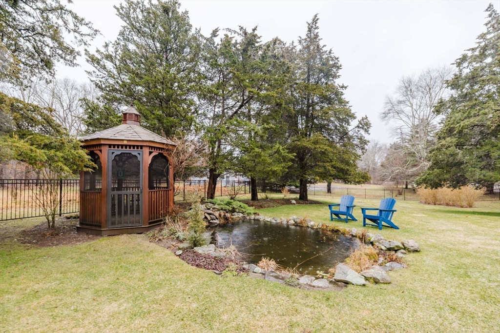 15 Ralsie Road Rehoboth, MA 02769 - Photo 6 of 32 a front view of a house with a yard and garage