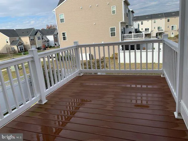 a view of balcony with wooden floor