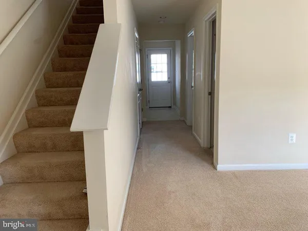 an entryway with a white walls