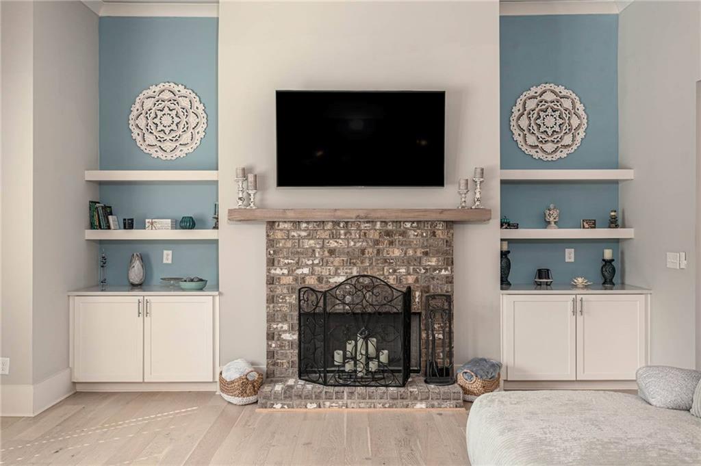 255 Old Town Road Dacula, GA 30019 - Photo 24 of 38 a living room with a fireplace and a flat screen tv