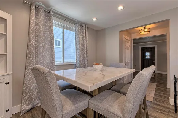 a kitchen with a sink cabinets stainless steel appliances and a counter space