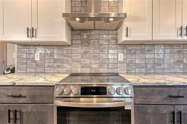 a view of a hallway with wooden floor and stairs
