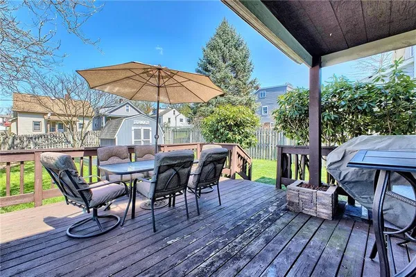 a patio with a patio table and chairs