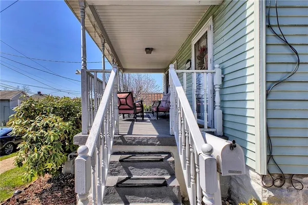 a view of kitchen with sink and wooden floor