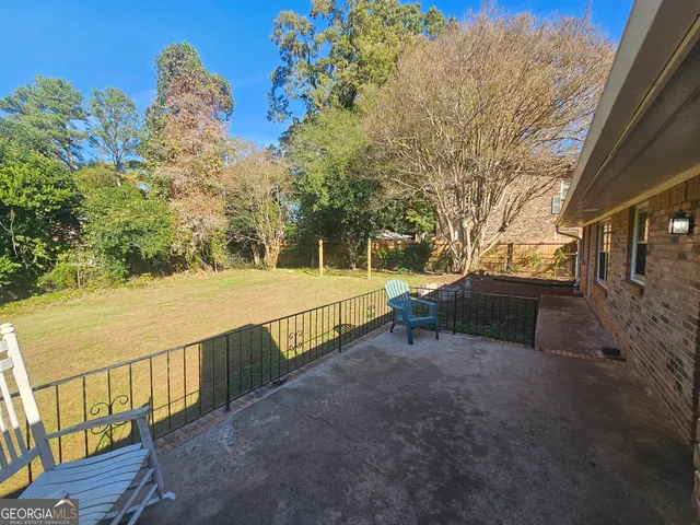 a view of a terrace with trees