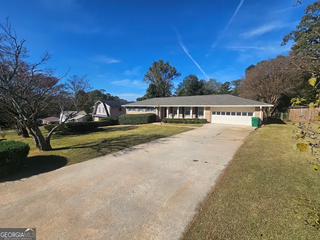 a view of swimming pool with trees in the background