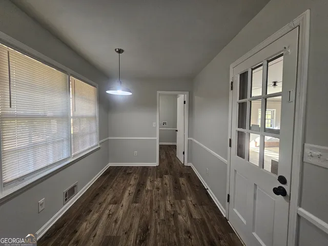 a view of hallway with windows