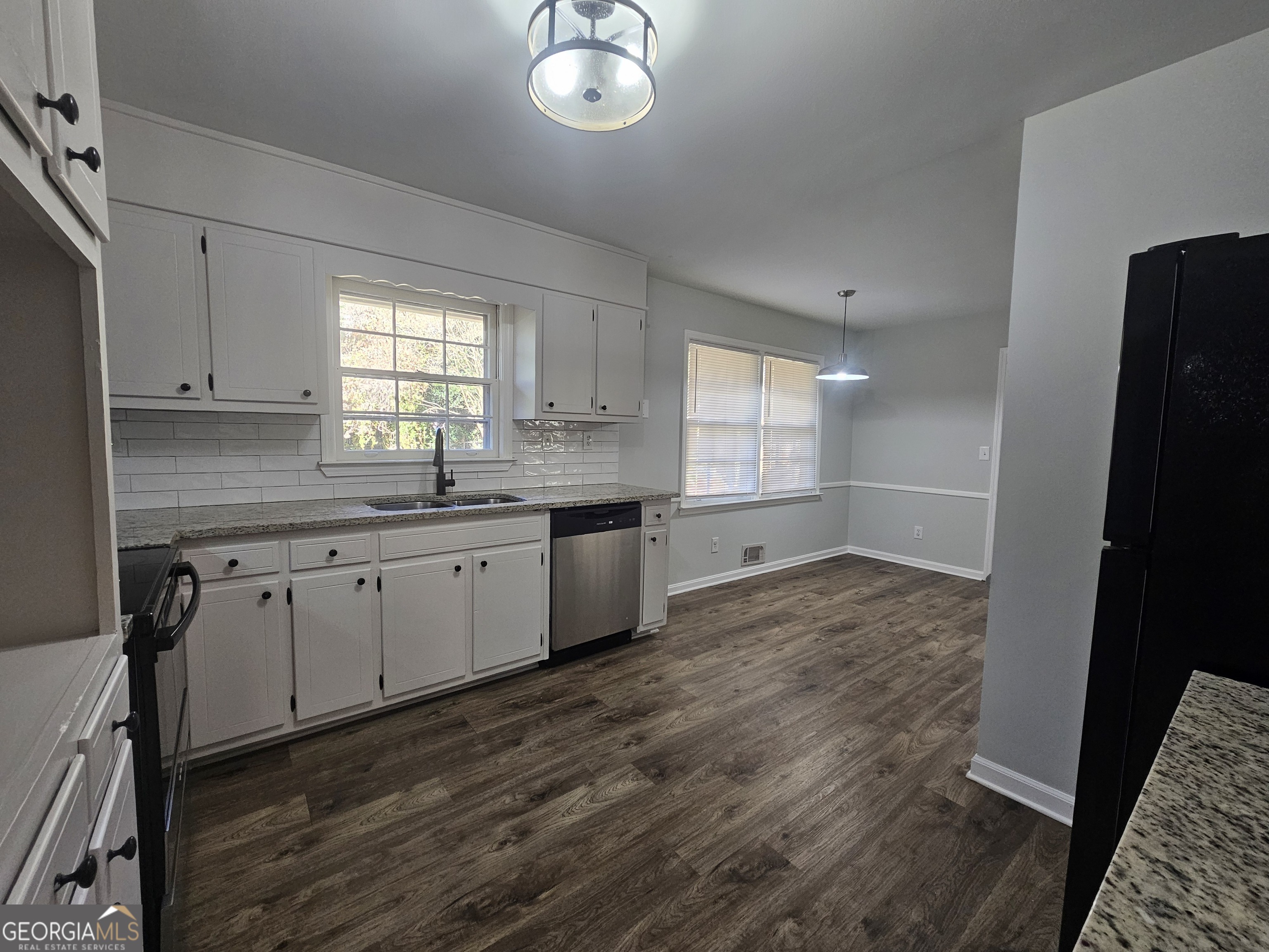 3750 Citation Drive Decatur, GA 30034 - Photo 24 of 44 a kitchen with a sink cabinets a window and stainless steel appliances