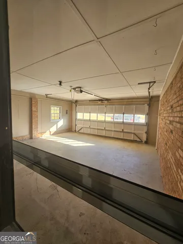 a view of room with window and hardwood floor