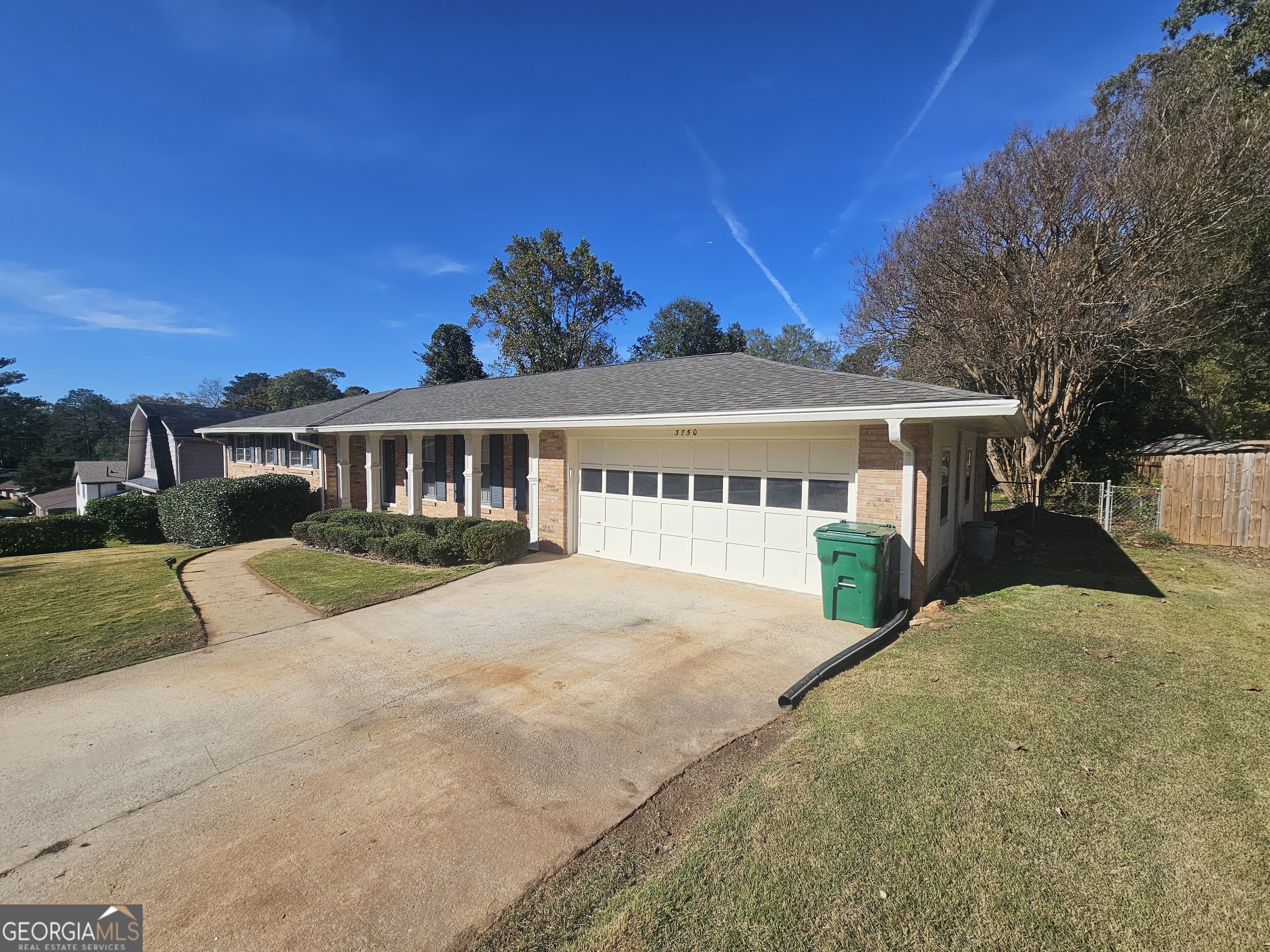 3750 Citation Drive Decatur, GA 30034 - Photo 3 of 44 a front view of a house with a yard and garage
