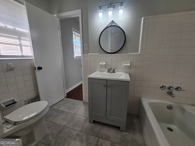 a bathroom with a sink and toilet