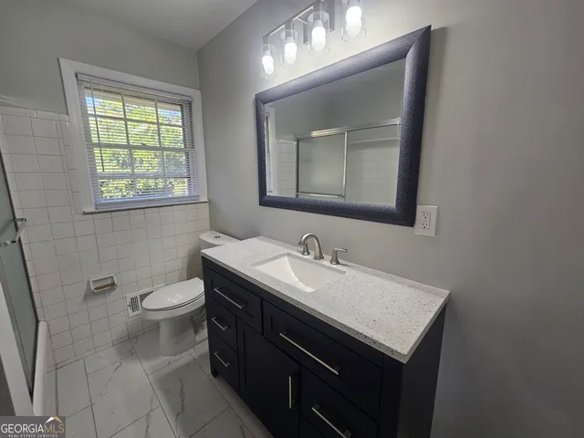 a bathroom with a sink and a shower
