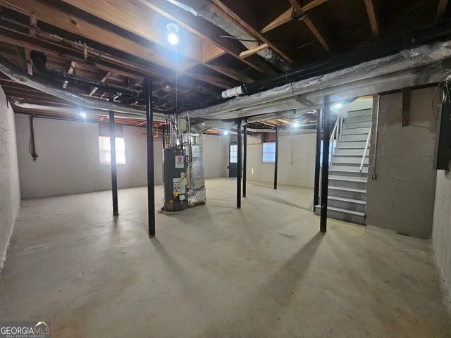 a view of empty room with wooden walls