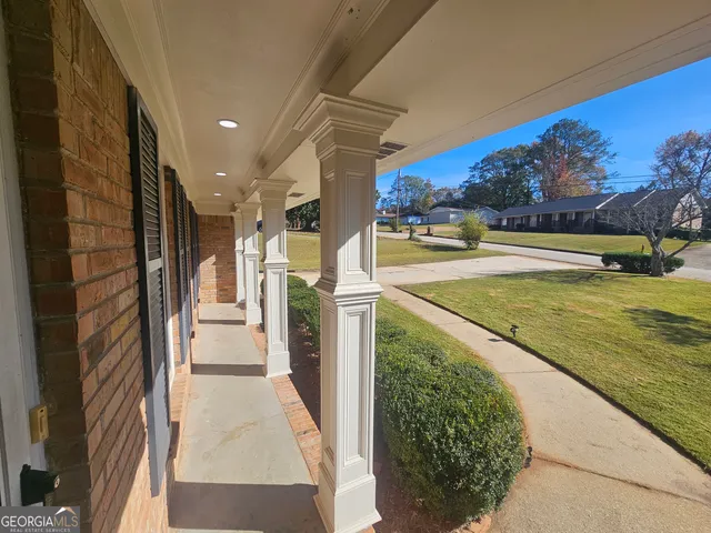 a view of a swimming pool with an outdoor seating