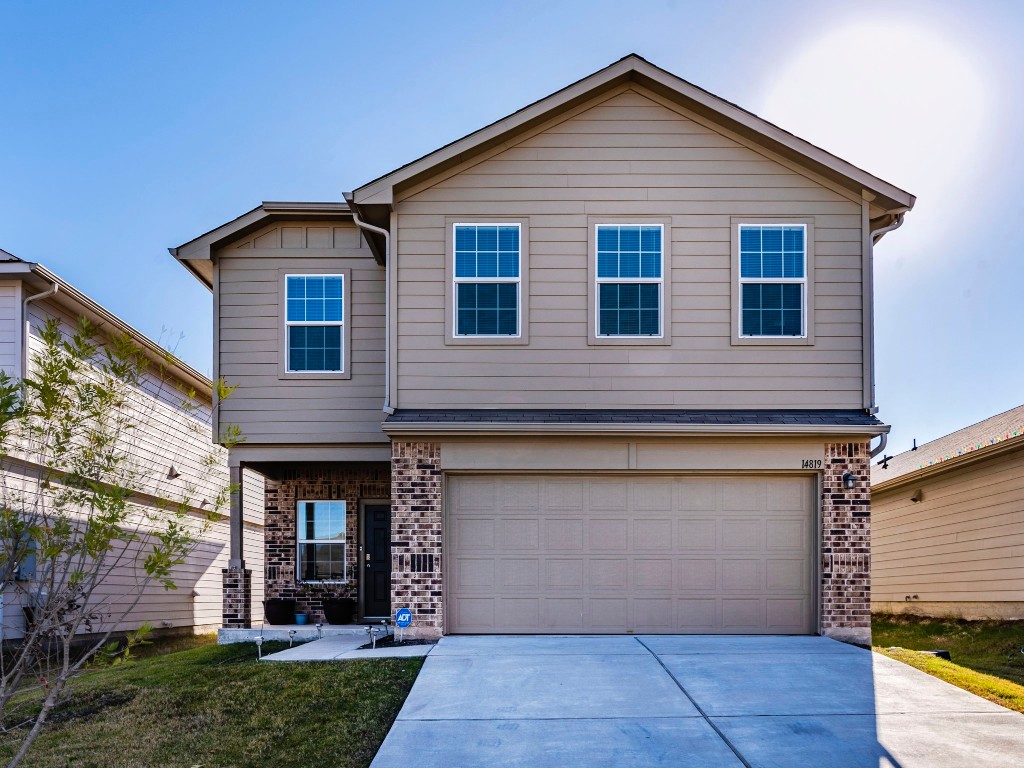 a view of house with yard