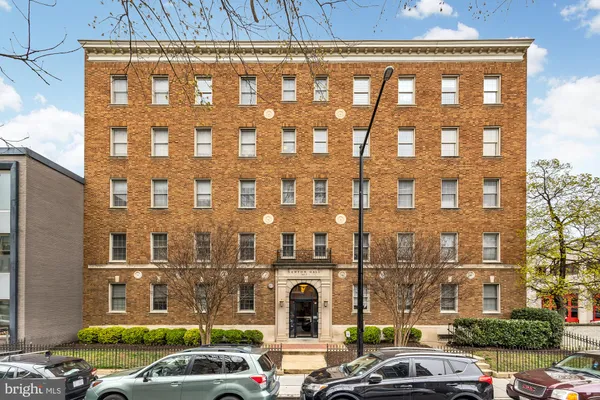 a front view of a building with a street