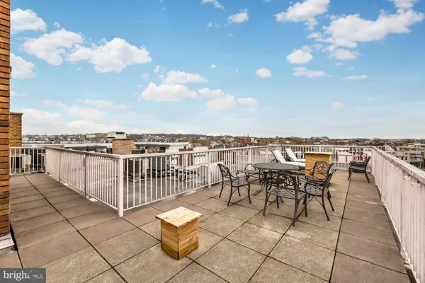a view of a terrace with furniture