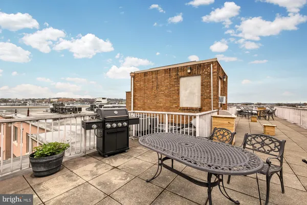 a view of a balcony with furniture