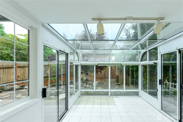 a house with pool in front of it