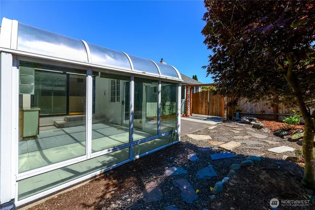 a view of a backyard with a patio