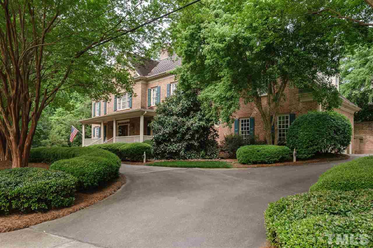 3103 Landor Road Raleigh, NC 27609 - Photo 1 of 25 a front view of a house with a yard and shrubs