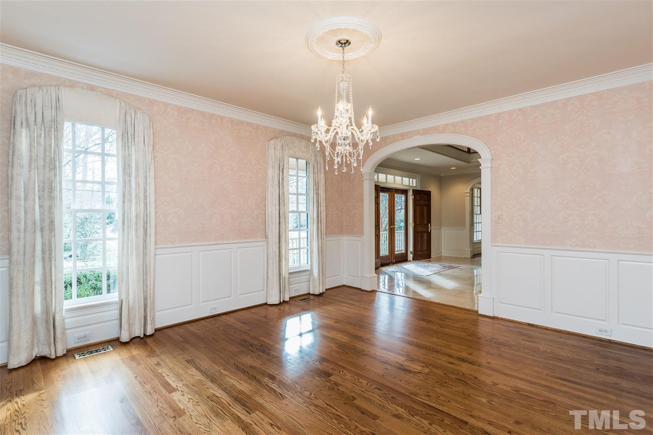 3103 Landor Road Raleigh, NC 27609 - Photo 6 of 25 a view of a room with wooden flooring and chandelier