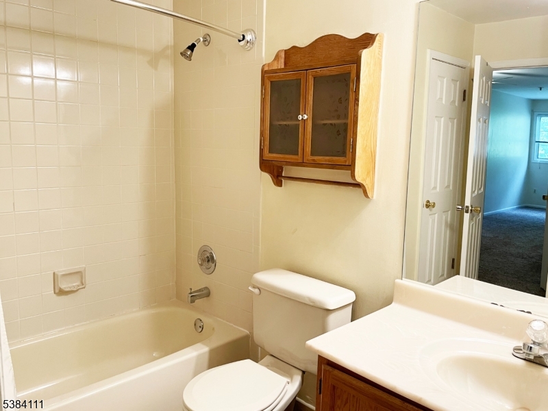 12 Leva Drive, Unit 12 Morristown, NJ 07960 - Photo 13 of 30 a bathroom with a sink toilet and shower